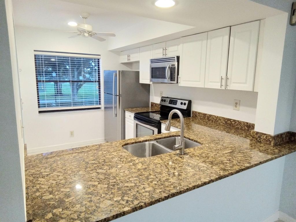 Photo of 12962 Briarlake Drive #201, Palm Beach Gardens, FL 33418 (MLS # R11024353)