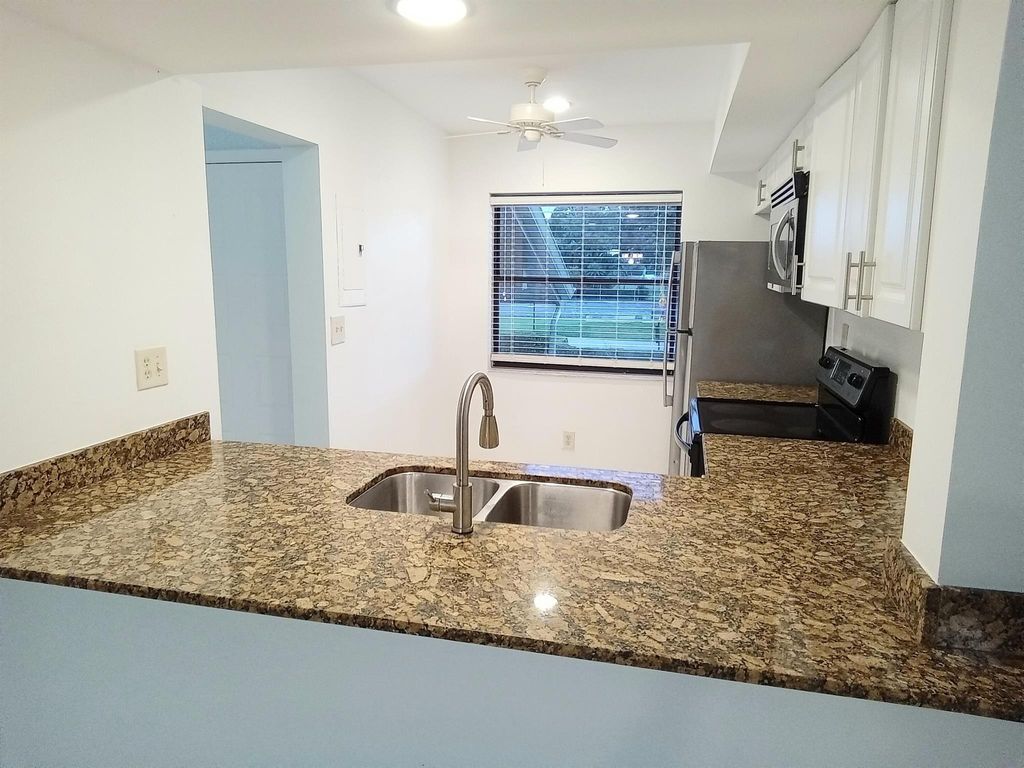 Photo of 12962 Briarlake Drive #201, Palm Beach Gardens, FL 33418 (MLS # R11024353)