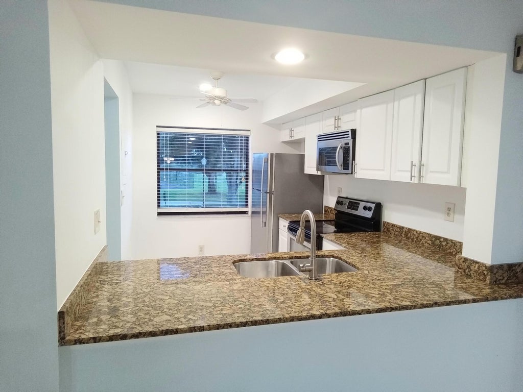 Photo of 12962 Briarlake Drive #201, Palm Beach Gardens, FL 33418 (MLS # R11024353)