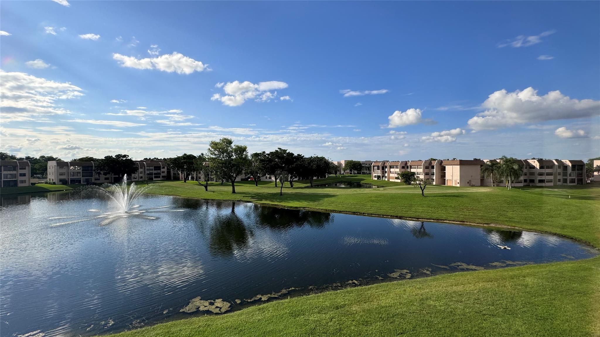 FANNIE MAE APPROVED - BUYERS MAY FINANCE WITH A MINIMUM OF 10% DOWN! 40-YR CERT COMPLETED! Spacious corner unit offers views of the lake, water fountain and golf course, providing a serene and picturesque backdrop. Magnificent sunset views. Lots of natural light. Spacious floor plan. New porcelain floors throughout, newly redone bathrooms, new baseboards, new doors and hardware, tankless water heater, newer A/C. Brand-new stainless-steel appliances, granite countertops. 55+ community strategically located. Maintenance fee includes cable & internet, etc. Recreation facilities include main pool at the clubhouse + 5 other pools within the community, golf courts, tennis courts, pickleball courts, gym, jacuzzi, courtesy bus, theater, ballroom, billiard, exercise classes, shuttle buses & more.