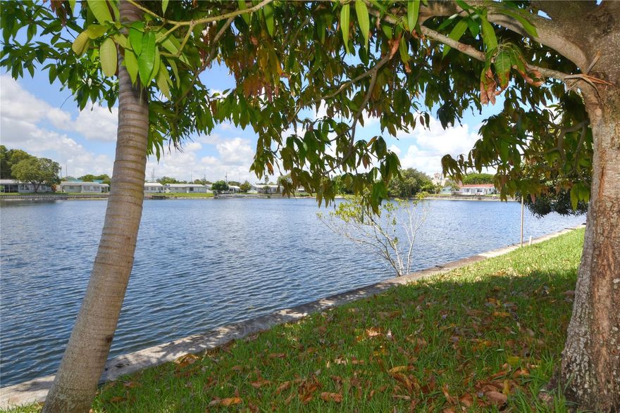 JUST LISTED! Centrally located 2/1 villa with fabulous lake views in Tamarac Lakes, centrally located and close to major highways, the Fort Lauderdale Executive airport, the ocean and so much more! This corner unit features tile floors, open kitchen, closets with buildouts, washer/dryer, central A/C, Florida room, and epic wide water views. Vacant and easy to show!