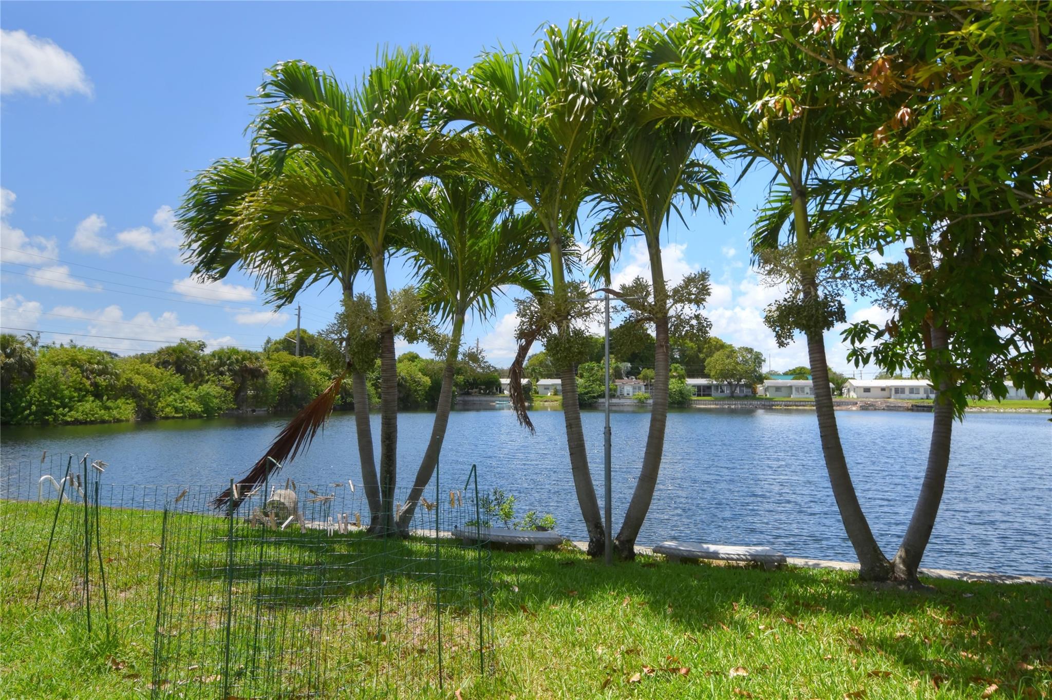 JUST LISTED! Centrally located 2/1 villa with fabulous lake views in Tamarac Lakes, centrally located and close to major highways, the Fort Lauderdale Executive airport, the ocean and so much more! This corner unit features tile floors, open kitchen, closets with buildouts, washer/dryer, central A/C, Florida room, and epic wide water views. Vacant and easy to show!