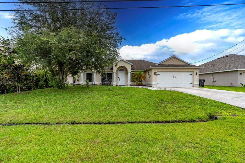 Photo of 4565 SW Wabash Street, Port Saint Lucie, FL 34953 (MLS # R11010851)