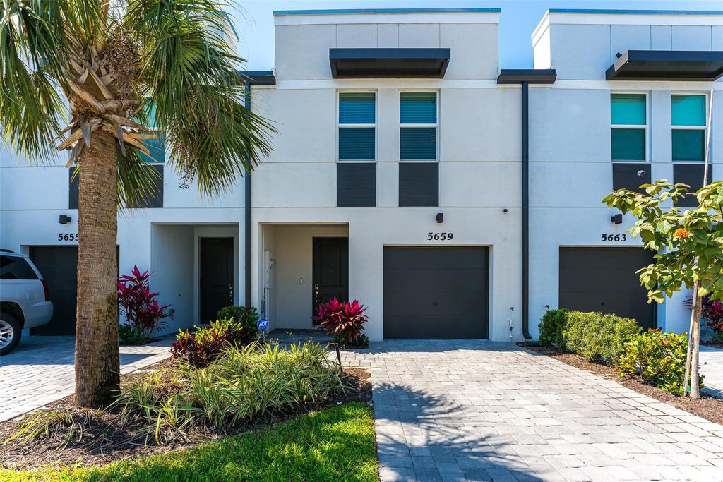 Photo of 5659 Enclave Dr, Mangonia Park, FL 33407 (MLS # F10532794)