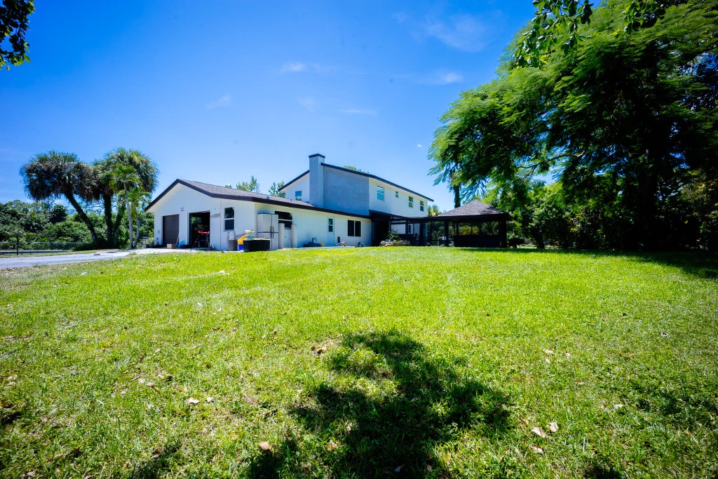 Photo of 9435 EL PASO Drive, Lake Worth, FL 33467 (MLS # B26075489)