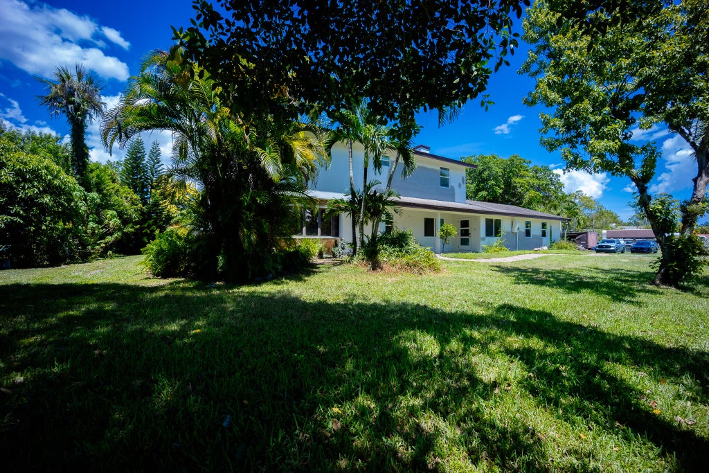 Photo of 9435 EL PASO Drive, Lake Worth, FL 33467 (MLS # B26075489)