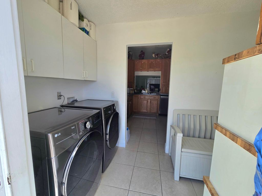 Photo of 1530 Royal Forest Court, West Palm Beach, FL 33406 (MLS # B26026982)