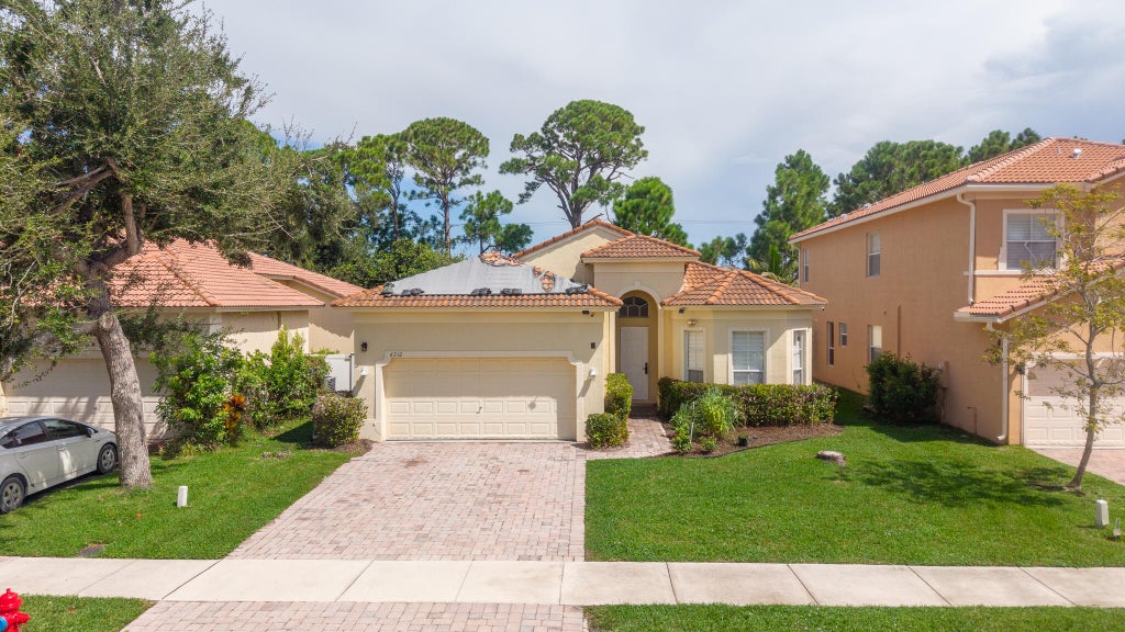 Photo of 6212 Spring Lake Terrace, Fort Pierce, FL 34951 (MLS # B26073091)