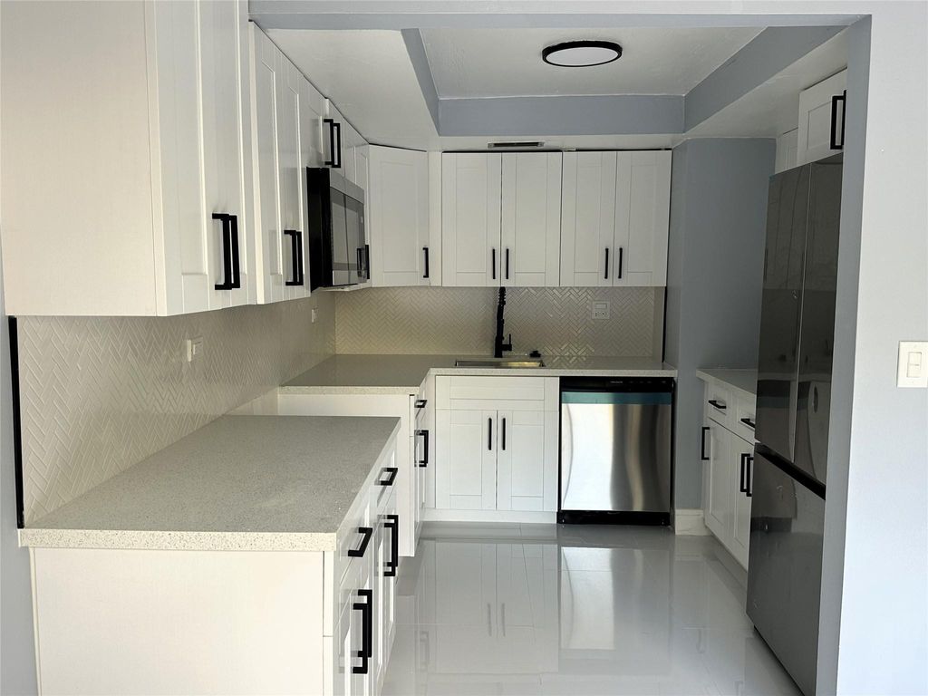 Photo of 8350 N Missionwood Circle #C-21, Miramar, FL 33025 (MLS # F10556522)