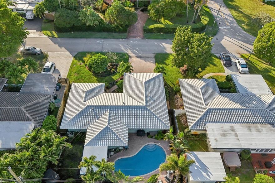 Located in the desirable Coral Woods neighborhood of Oakland Park, this inviting pool home offers relaxed South Florida living. The updated kitchen features quartz countertops, while a light-filled Florida room—currently used as a dining space—adds flexibility for everyday living and entertaining. Wood floors bring warmth throughout, and updated bathrooms provide added comfort. Step outside to enjoy a private pool perfect for weekends at home. The property also includes a power outlet for electric vehicle charging. Conveniently located minutes from the beach, Wilton Manors, and downtown Fort Lauderdale.