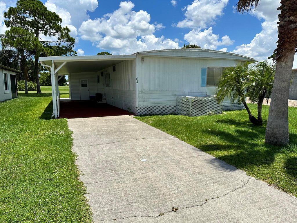 Photo of 64 Golf Drive, Port St Lucie, FL 34952 (MLS # R10897839)