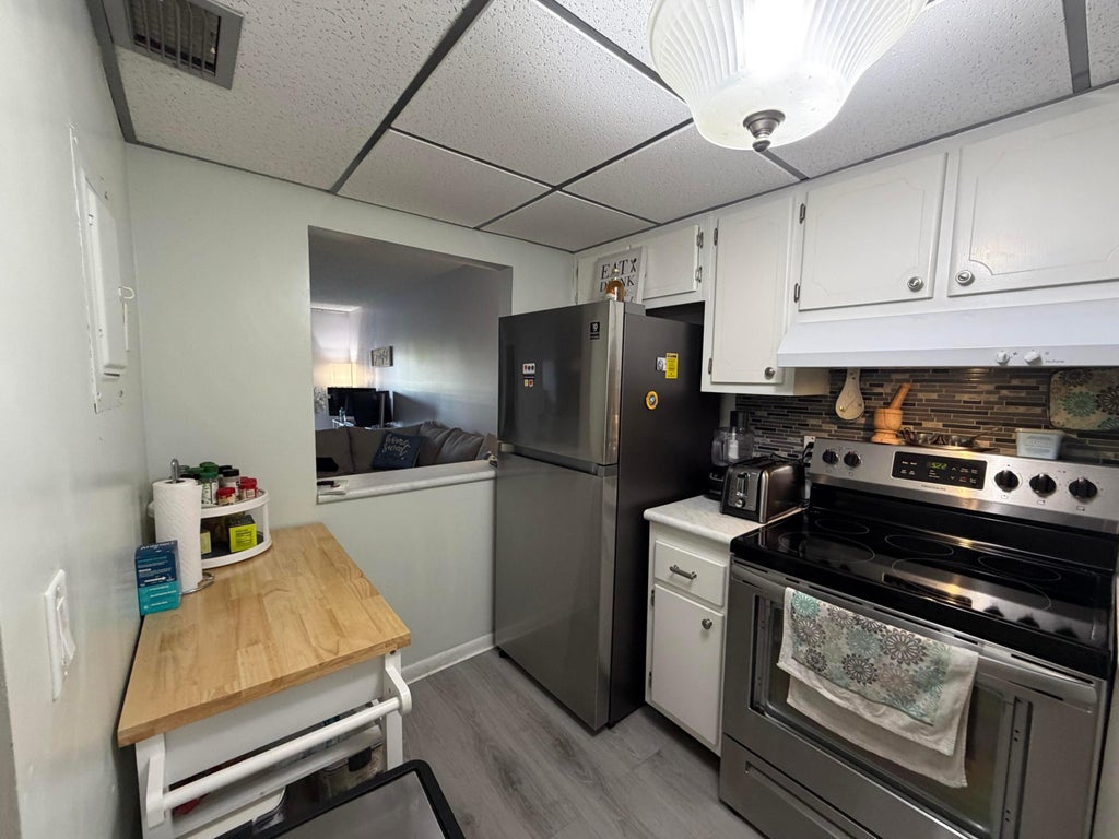 Photo of 1630 EMBASSY Drive #311, West Palm Beach, FL 33401 (MLS # B26070635)