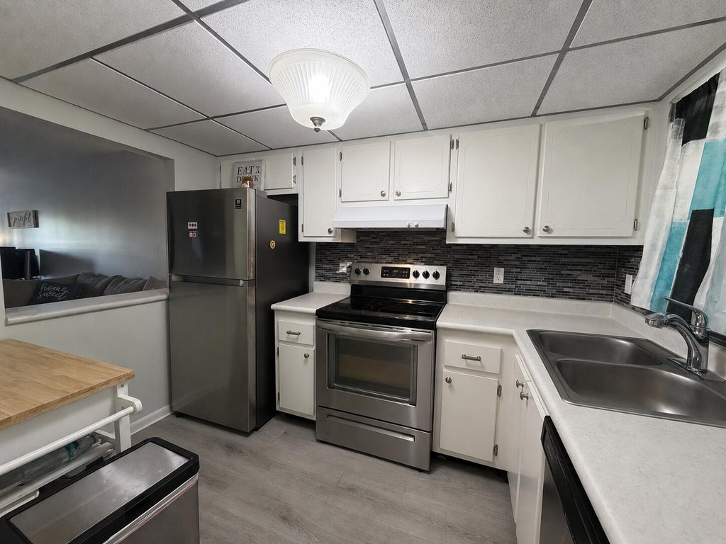 Photo of 1630 EMBASSY Drive #311, West Palm Beach, FL 33401 (MLS # B26070635)