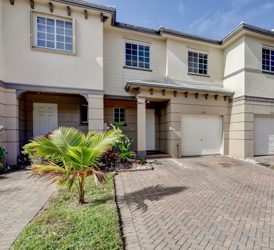 Come tour this lovely townhouse in the sought-after quiet gated community of Marsh Harbour. The home includes a beautifully updated kitchen with stone countertops, custom cabinetry, and stainless steel appliances. There is ceramic tile throughout the ground floor and lovely hardwood floors in the upstairs bedrooms and loft area. The home has a peaceful backyard area with an extended patio, and canal, it's great for entertaining your guest. The ground floor has a half bath that's convenient for guests. The home is equipped with ADT home security and storm protection. The AC is 3 years old. The community has a low HOA of $233 which includes high-speed internet, basic cable, building exterior insurance, and the roof. (Click for More) The amenities include a pool with a hot tub, fitness center, tennis courts with lights, a playground, a clubhouse, and a 24hr gate security. Marsh Harbour is conveniently located mins to I95, Turnpike, and the Tri-Rail. It's close to shopping centers, schools K-12, and a short ride to the beach. Leasing is ok, no commercial vehicles past 9 pm. 2 pets are allowed, 25lbs, no aggressive breeds. Great for first-time homebuyers, a small family, or investors. Come see it today!