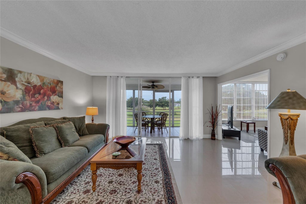 Photo of 3001 S Course Drive #301, Pompano Beach, FL 33069 (MLS # B26077497)