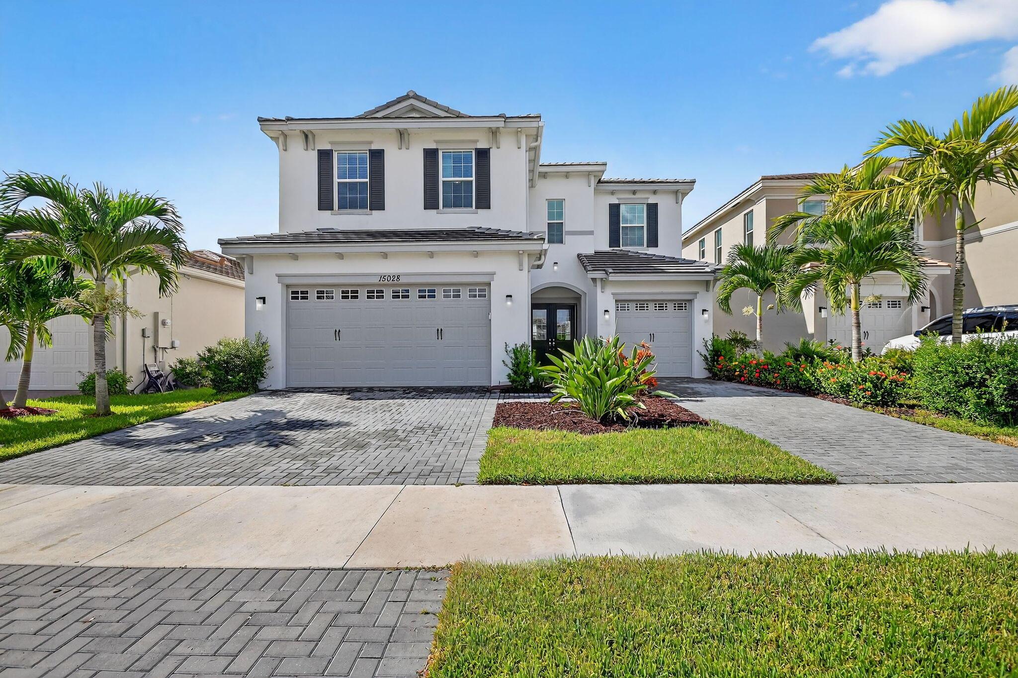 Welcome to the highly sought-after Poinciana Model in the desirable Orchards community of Westlake! This beautifully maintained home offers 2,982 sq. ft. living space, featuring 4 bedrooms, including 2 master suites, 3.5 bathrooms, a very convenient 3 car garage. With over $50,000 in upgrades, this home is sure to impress!Step through elegant double doors into a modern interior with upgraded tile flooring throughout the first floor. The spacious main living area includes a formal dining room, breakfast nook, family room and a formal living/flex room with sliding glass doors that lead seamlessly to the covered lanai, perfect for indoor-outdoor living.