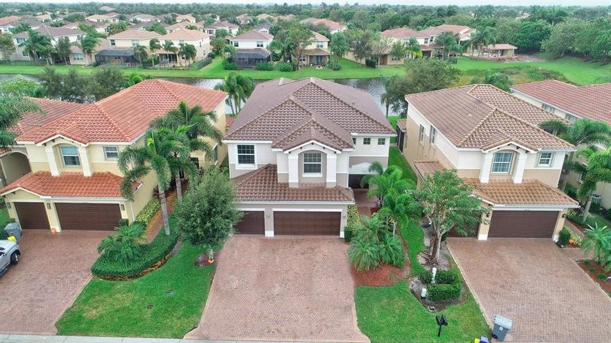 Welcome Home to this beautiful 6 bedroom 5 bath lakefront home in the guard-gated community of Canyon Trails. Spacious, open Kitchen has Granite countertops, Stainless Steel Appliances, Center Island, Double Oven, and ample cabinet space. A guest bed & bath completes the 1st floor. Upstairs features a loft, massive master suite with custom walk-in closet and bathroom with separate vanities and Jacuzzi tub, covered balcony that overlooks a beautiful, tranquil lake, and 4 more bedrooms. Features include full hurricane protection, Formal Dining Room, 3-car garage, and Tile and Wood flooring. Canyon Trails has world class amenities that include a Resort-Style pool, Tot's water play area with spray stations, 2 Har-Tru tennis courts, basketball courts, a fitness center and an indoor gym. Located close to shopping, dining, entertainment, "A" rated schools, major highways and airports.