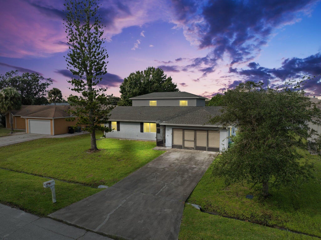 Photo of 1610 SW Buffum Lane, Port Saint Lucie, FL 34984 (MLS # R11023618)