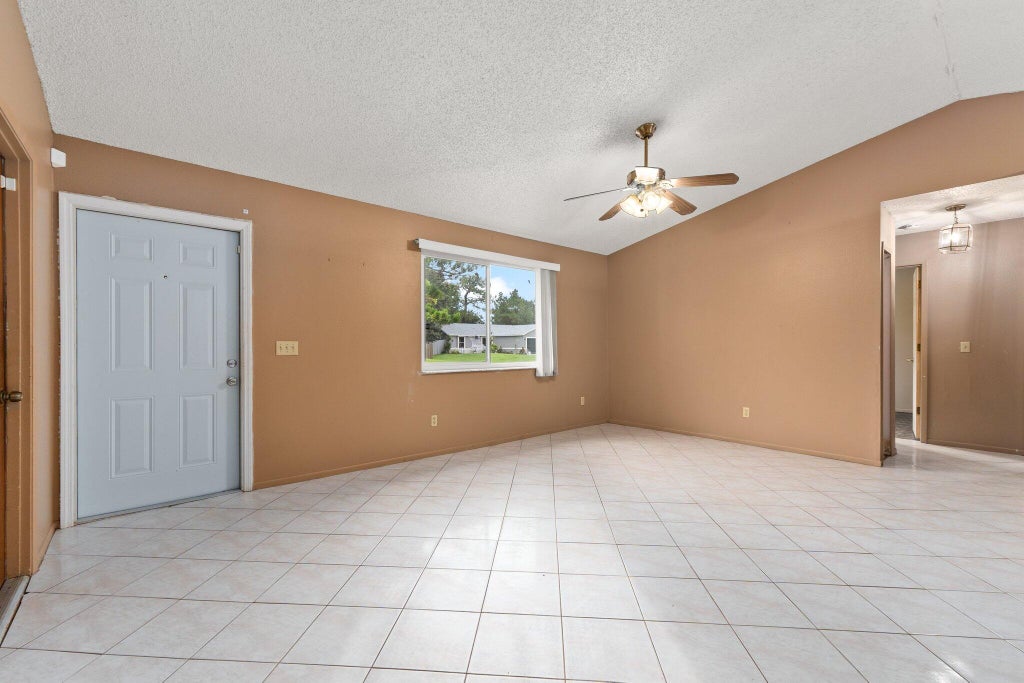 Photo of 1610 SW Buffum Lane, Port Saint Lucie, FL 34984 (MLS # R11023618)