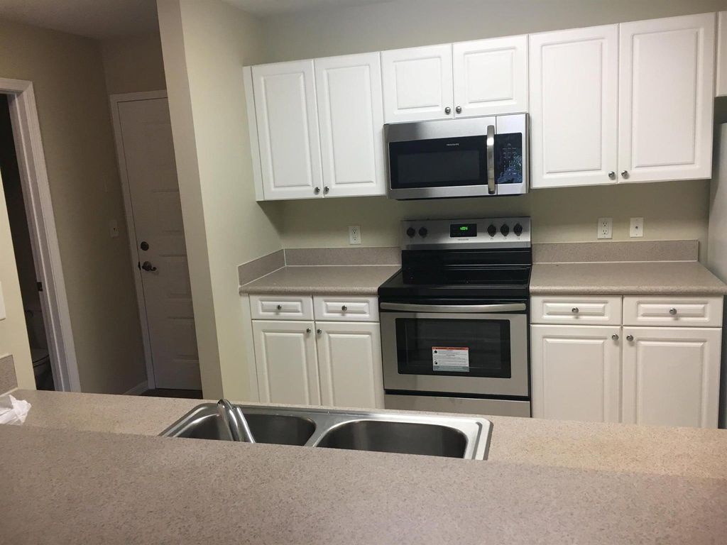 Photo of 1203 Town Center Drive #219, Jupiter, FL 33458 (MLS # R11030189)
