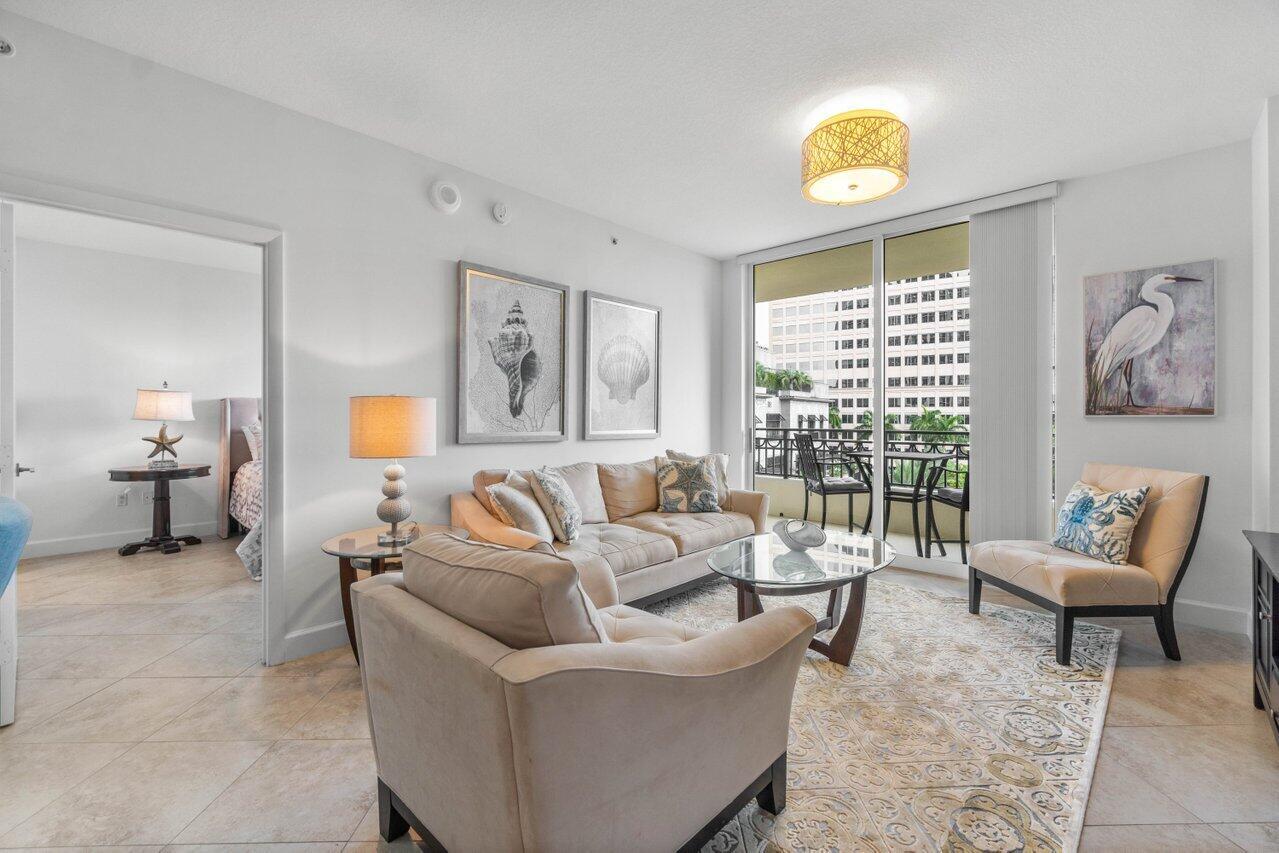 Available Now through end of December! Welcome to your light, bright and airy sanctuary! Experience, the epitome of modern living in this exquisite fully furnished retreat. Perfectly situated in the heart of booming and picturesque Downtown West Palm Beach, mere steps away from all the vibrant action! Indulge in unparalleled relaxation as you unwind on your private balcony oasis, offering breathtaking sunsets, a serene sea of palm trees, and mesmerizing city views that come alive with a twinkle after dusk. Step inside and be captivated by the contemporary open layout, adorned with ceramic tiles & beachy decor throughout that effortlessly flow throughout the living room and bedrooms. The kitchen boasts elegant granite countertops, stainless steel appliances, & an abundance of storage space