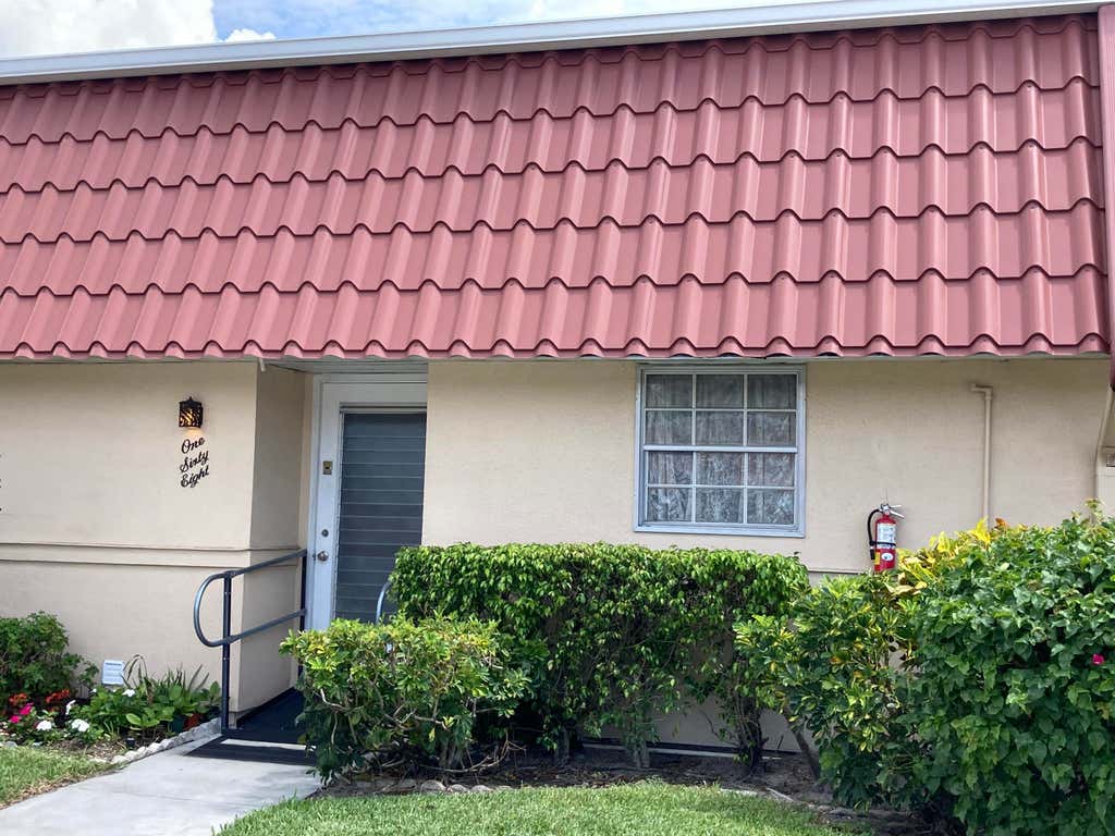 Photo of 168 Amherst Lane Ln, Lake Worth Beach, FL 33467 (MLS # R10808037)
