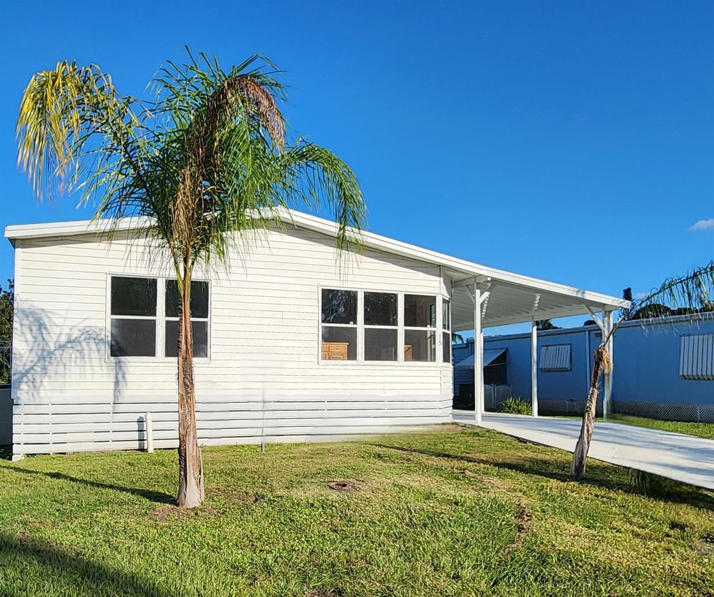 Photo of 15 SE Iberian Lane, Port Saint Lucie, FL 34952 (MLS # R11032262)