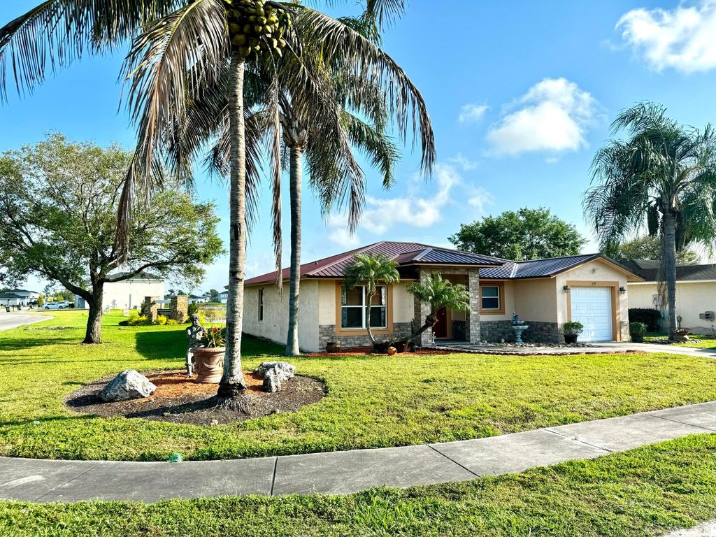 Photo of 139 Dabou Loop, Belle Glade, FL 33430 (MLS # R10969863)