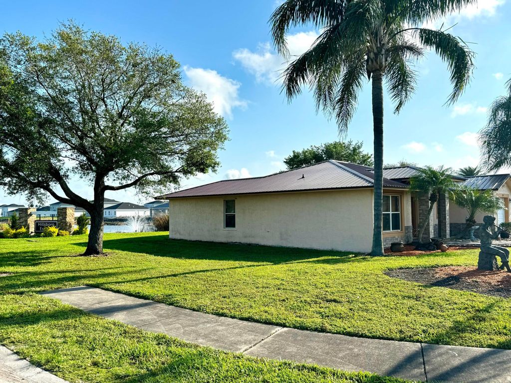 Photo of 139 Dabou Loop, Belle Glade, FL 33430 (MLS # R10969863)
