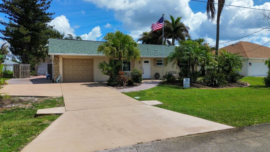 Come witness paradise at 253 SW Chapman Ave. This 3 bedroom, 2 bath home, with a flex room and family room, is absolutely incredible! This property makes you feel like you have access to your own private get-a-way! From the beautiful landscape and pavers around the exterior of the home, to the privacy and huge backyard that comes with so many options, you will not want to miss this opportunity! When you step foot on the property, especially inside the home, you will realize that this property is loved and has been taken care of extremely well. From the finishing touches in the bathrooms, to the crown mold around the interior, you will be so impressed! Plenty of room for your boat/RV with the additional driveway space on the side of the home, plus the safety of being at the end of the road!