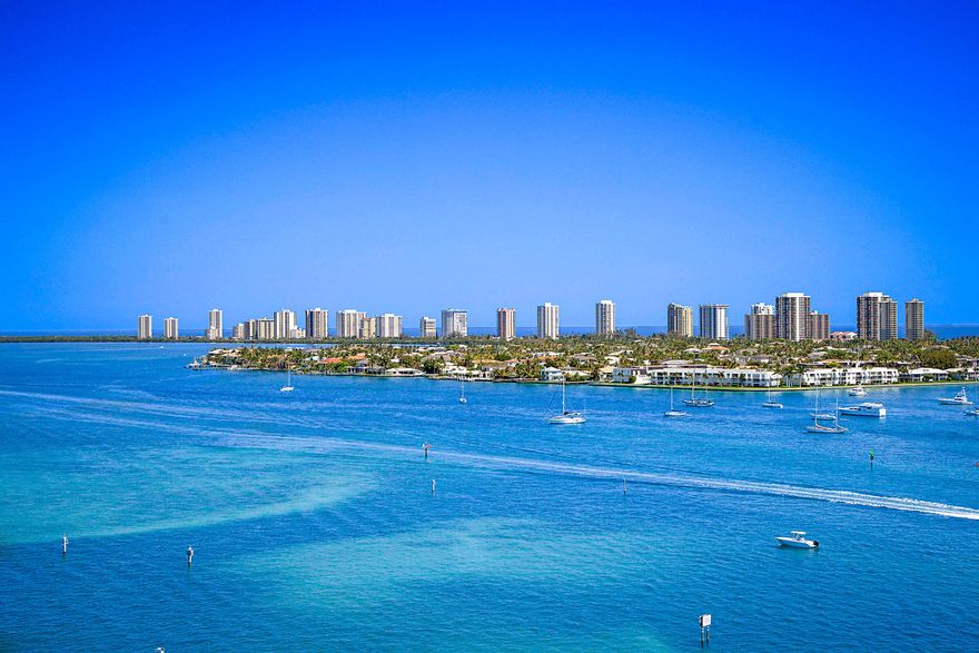 Have you ever envisioned owning a residence with multimillion-dollar, unobstructed waterfront views—without the multimillion-dollar price tag? This is your rare opportunity.Perched on the highly desirable southeast corner of the 14th floor, this exceptional "16 stack" residence at Marina Grande Condominiums offers what is arguably one of the most breathtaking vantage points in all of Palm Beach County. From the moment you enter, you are captivated by sweeping 180-degree panoramic views—stretching south across the Intracoastal from Palm Beach to North Juno Beach, while simultaneously capturing the shimmering turquoise waters of the Atlantic Ocean to the east. Views of this caliber are truly irreplaceable—and impossible to recreate.  • Approximately 1,800 sq ft of interior living space  • Expansive 154 sq ft private balcony ideal for sunrise and evening entertaining  • 3 Bedrooms | 3 Full Bathrooms  • Rare end-unit positioning with additional south-facing windows for enhanced natural light  • Motorized window treatments in the living area  • Updated kitchen featuring:  o New stainless steel appliances  o Double ovens + warming drawer  o Elegant granite countertops  • Full-size new washer & dryer in dedicated laundry room   Residents of Marina Grande enjoy a private, resort-inspired lifestyle with world-class amenities, including: • Newly renovated waterfront pool deck  • Tennis, pickleball & bocce courts  • Expansive state-of-the-art fitness center  • Sauna & steam rooms  • Elegant billiards & card lounges  • 24-hour concierge & security  • Valet services  For boating enthusiasts, a full-service marina just steps away provides effortless access to the Intracoastal and direct ocean entry within minutes—an unparalleled advantage for the South Florida lifestyle.  Ideally situated in the heart of the Palm Beach waterfront corridor: • 5 minutes to the pristine beaches of Singer Island  • Near Phil Foster Park — internationally known for snorkeling and diving  • 15 minutes to the Port of Palm Beach  • 20 minutes to Palm Beach International Airport  • Minutes from the world-renowned luxury of Palm Beach and West Palm Beach, offering fine dining, designer shopping, golf, and cultural attractions  This residence represents a hidden luxury gem under $1 million—an extraordinary value for a corner waterfront condo with irreplaceable views, resort amenities, and premier location.