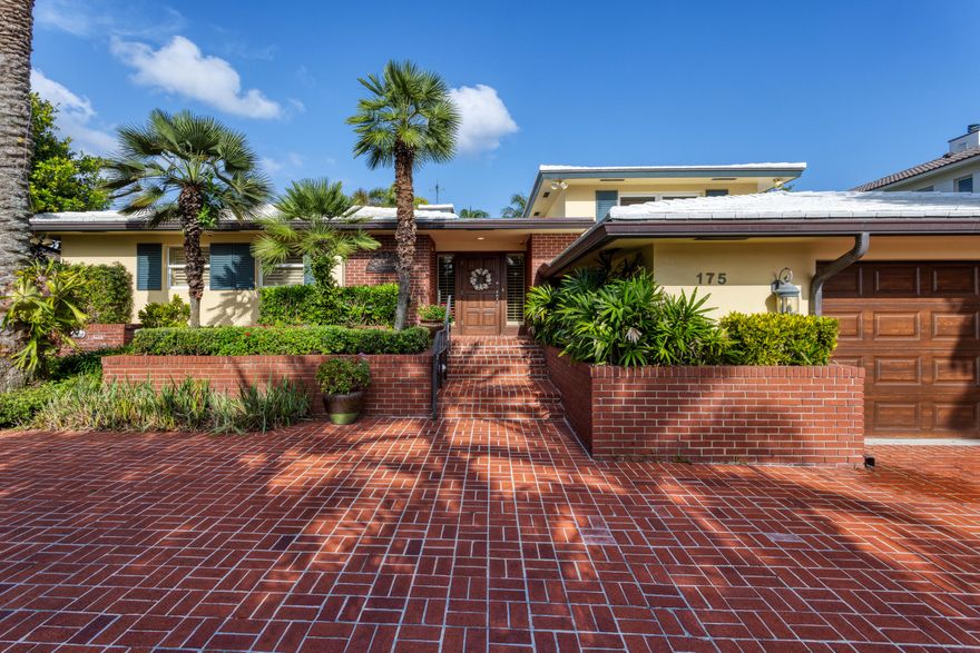 Intracoastal multilevel residence featuring 3 bedrooms, 3.5 bathrooms, an office, large open living areas, impressive outdoor living area and a freeform pool and private dock.