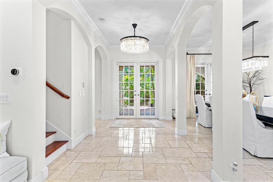 Front and center in one of North Palm Beach's most coveted addresses, this statement estate sits inside the 24/7 North Palm Beach Police-monitored gates of Nativa, a private enclave of just 14 custom residences. Perfectly positioned in the heart of it all, you're minutes to hundreds of dining options in Palm Beach Gardens, with easy cut-through access on Lighthouse Drive to the beaches of Juno and Singer Island, and only steps from the North Palm Beach Recreation Center. This home delivers the rare combination of prime location, unmatched security, and true resort-style living.Offering over 4,000 square feet of CBS-built luxury, the home features 4 bedrooms (including a ground-floor primary suite), 5.5 bathrooms, a dedicated office/den--->