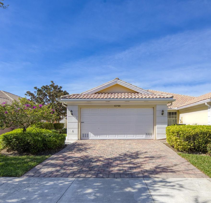 Welcome to this beautifully maintained 2-bedroom, 2-bathroom, 2-car garage villa in the highly sought-after Lakes at Tradition, an all-ages, resort-style community known for its peaceful atmosphere and unbeatable convenience. Located just minutes from Tradition Town Center's shops, dining, and community events, this home offers the perfect blend of comfort and lifestyle.Step inside to a bright and inviting layout featuring fresh interior paint and brand-new stainless steel Whirlpool appliances. The kitchen opens seamlessly to the spacious living and dining areas. The living room features DiVosta's signature mirrored wall unit an elegant and timeless built-in that adds depth, abundant storage, and a polished look that elevates the entire space.