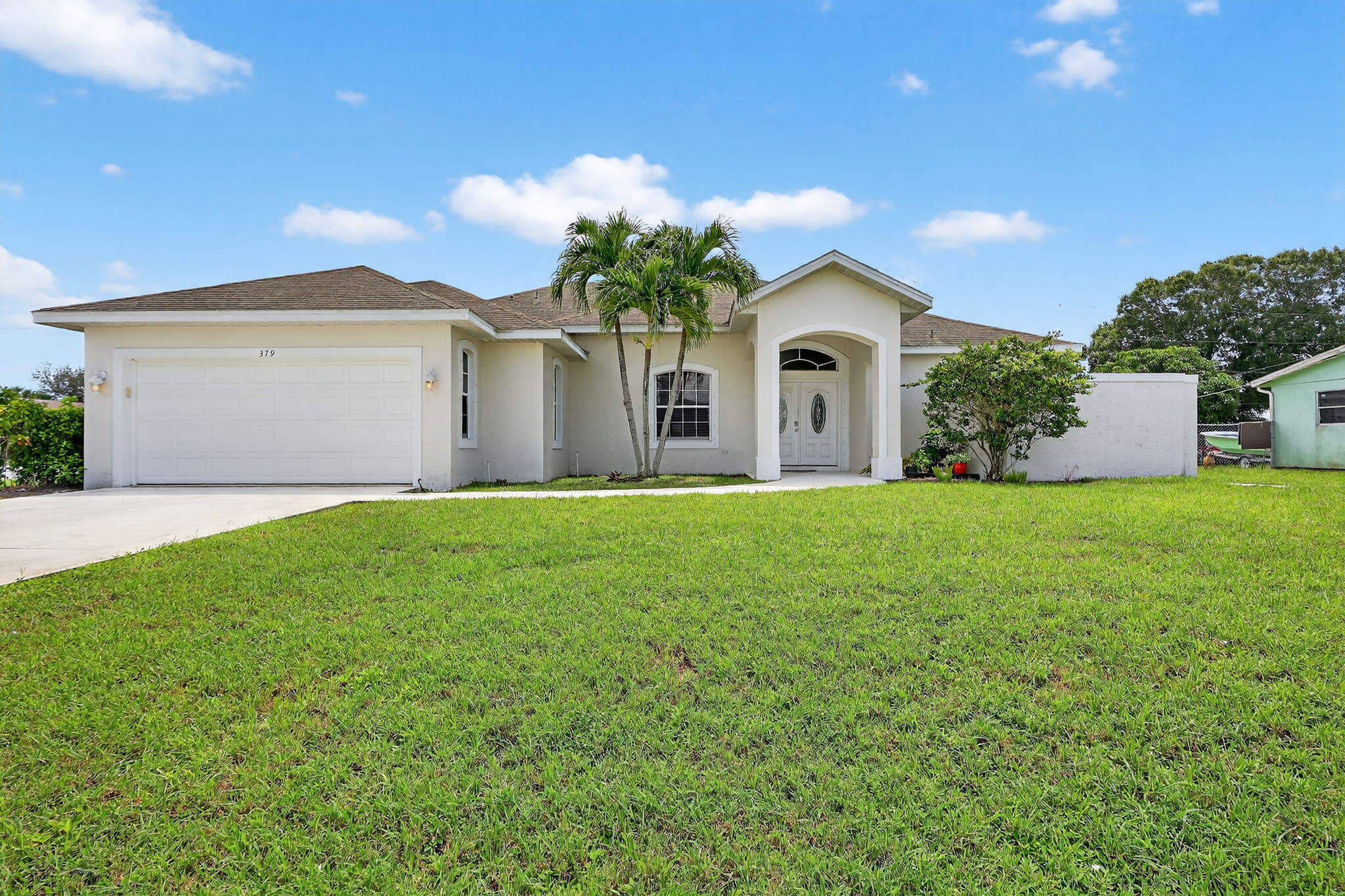 Large and Clean home on a corner lot. 3 Bedroom 2.5 Bath over-sized 2 Car Garage, close to Saint Lucie West. Recently painted and cleaned to be available on August 1st 2025