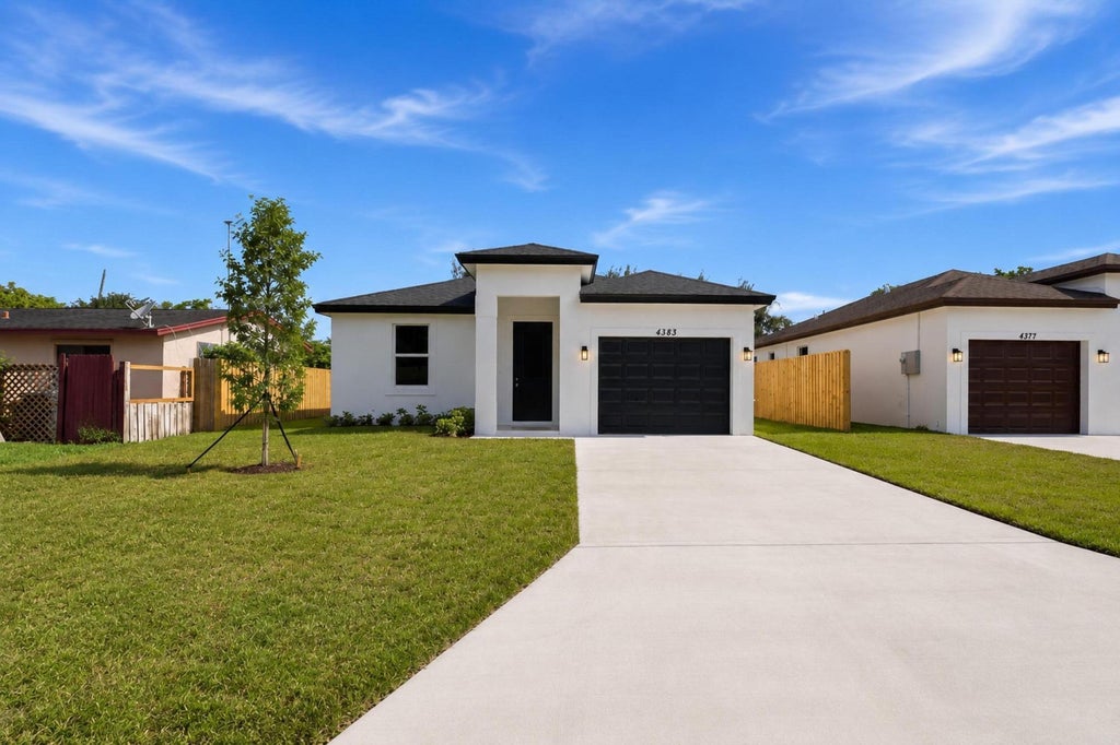 Photo of 4383 Marilyn Drive, Lake Worth, FL 33461 (MLS # B26079462)