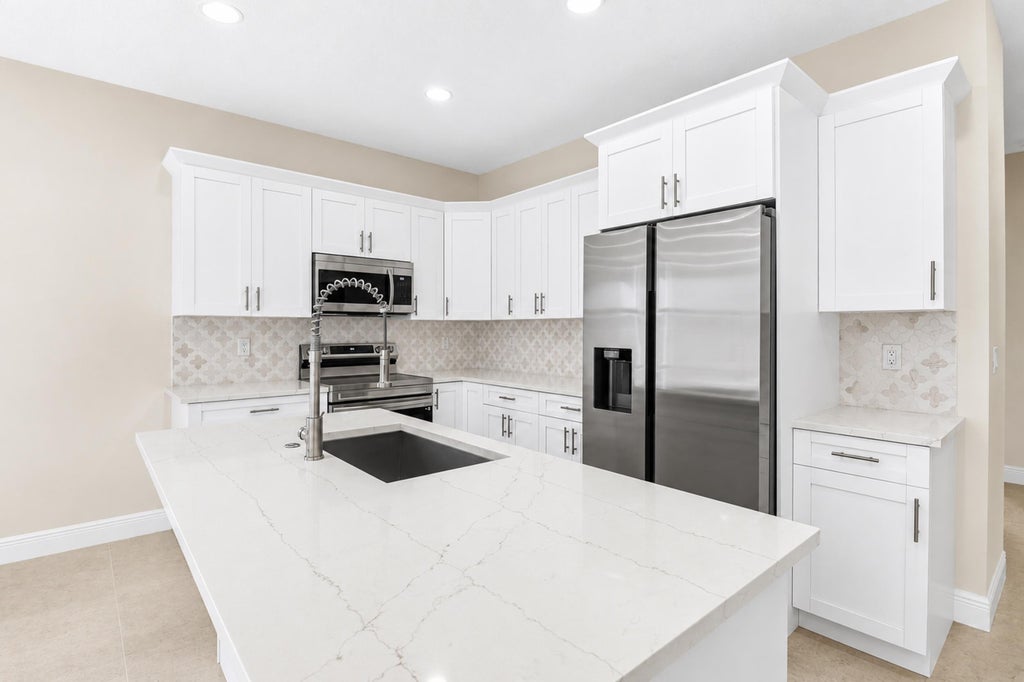 Photo of 4383 Marilyn Drive, Lake Worth, FL 33461 (MLS # B26079462)