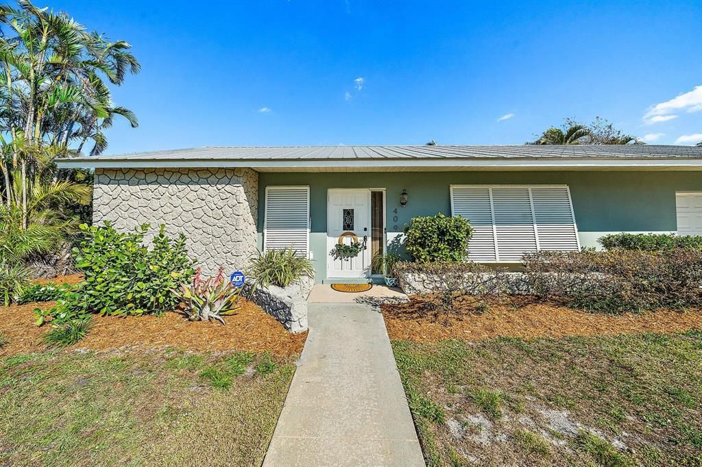 Photo of 409 Douglas Drive, Jupiter, FL 33458 (MLS # R10869875)