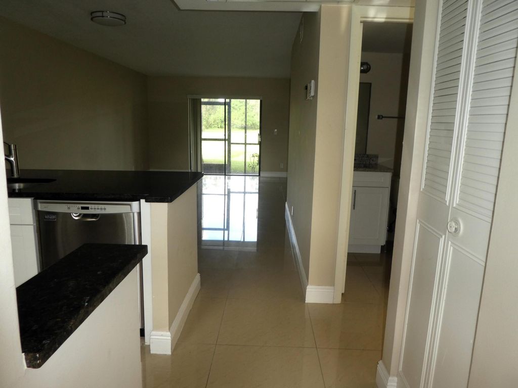 Photo of 7113 Golf Colony Court #106, Lake Worth, FL 33467 (MLS # B26002160)