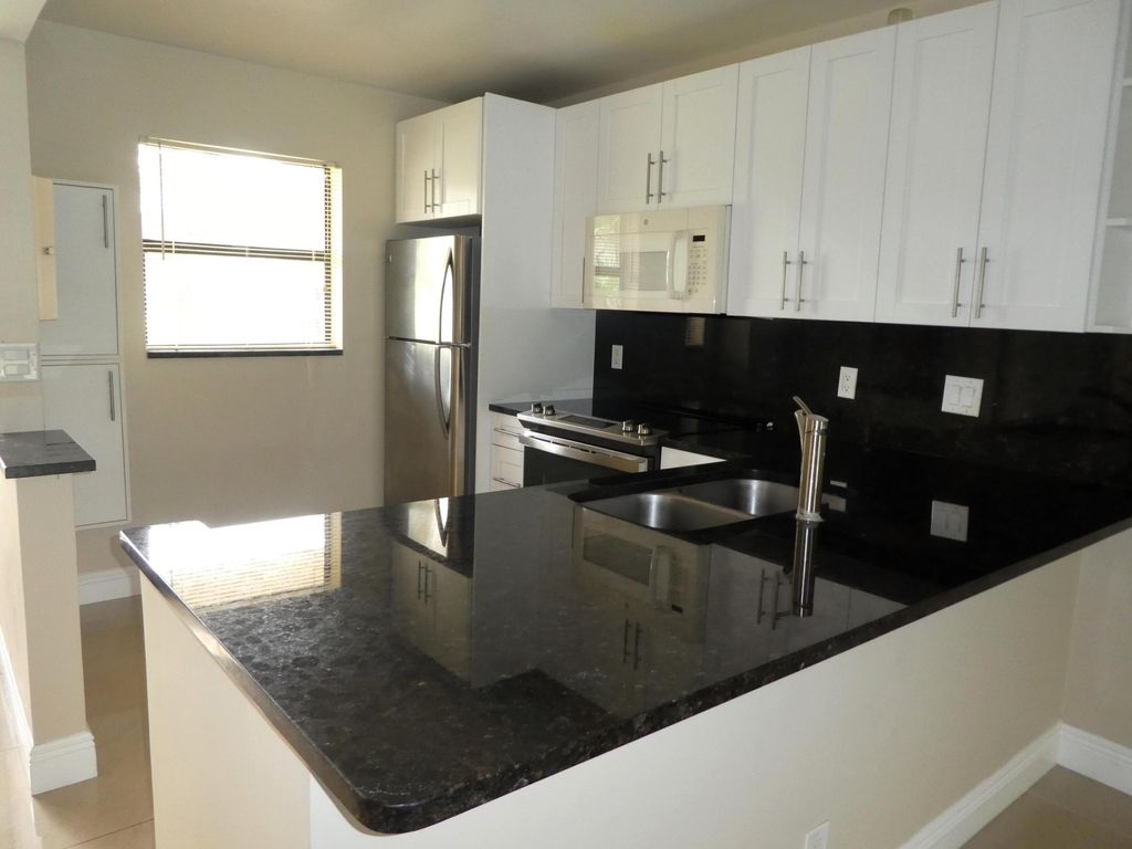 Photo of 7113 Golf Colony Court #106, Lake Worth, FL 33467 (MLS # B26002160)