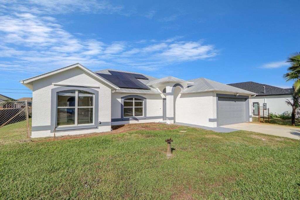 Photo of 551 SW Lawler Avenue, Port Saint Lucie, FL 34953 (MLS # R10958669)