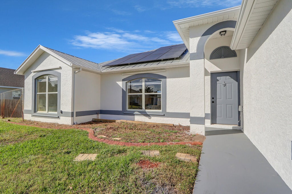 Photo of 551 SW Lawler Avenue, Port Saint Lucie, FL 34953 (MLS # R10958669)