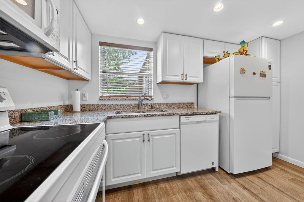 Photo of 211 Lake Dora Drive, West Palm Beach, FL 33411 (MLS # B26012450)