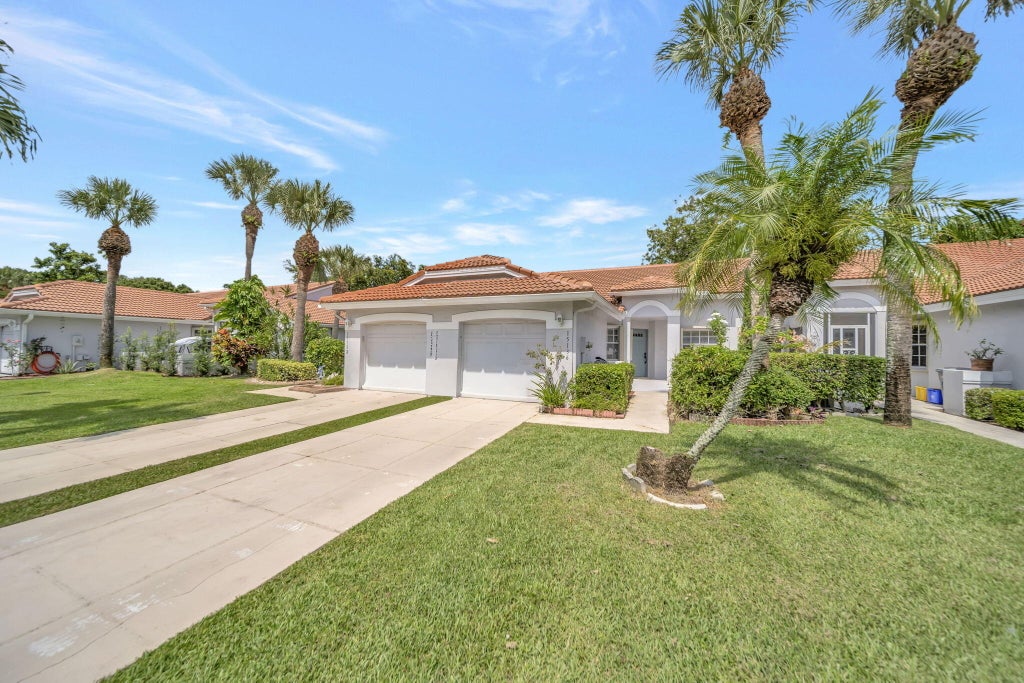 Photo of 15136 W TRANQUILITY LAKE Drive, Delray Beach, FL 33446 (MLS # B26079161)