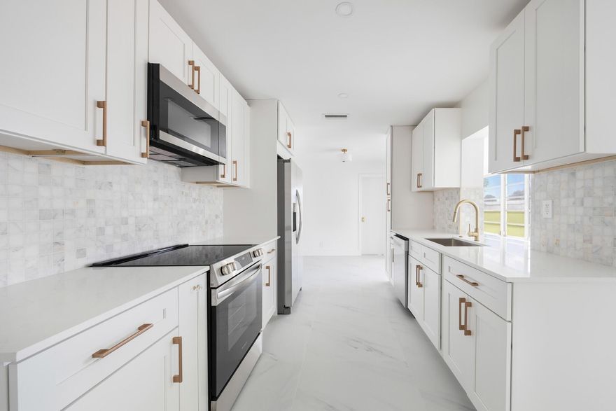 Created with love & attention to detail, this newly renovated 2 bed/ 2 bath home offers a NEW ROOF and beautiful finishes throughout. As soon as you walk into the home you'll enjoy the interior designer's appointed details that shine through lots of natural light like luxury large format flooring porcelain marble look flooring, smooth drywall, quartz & marble surfaces, new appliances, floating vanities, gold accents, a large kitchen and open concept living. And it would not be a true Florida home without a sunroom. This is the largest model in the neighborhood, situated on a prime corner lot just steps away from the pool and community clubhouse. Low monthly HOA, 55+ Community as per HOA, centrally located. Come be impressed. Flood zone X