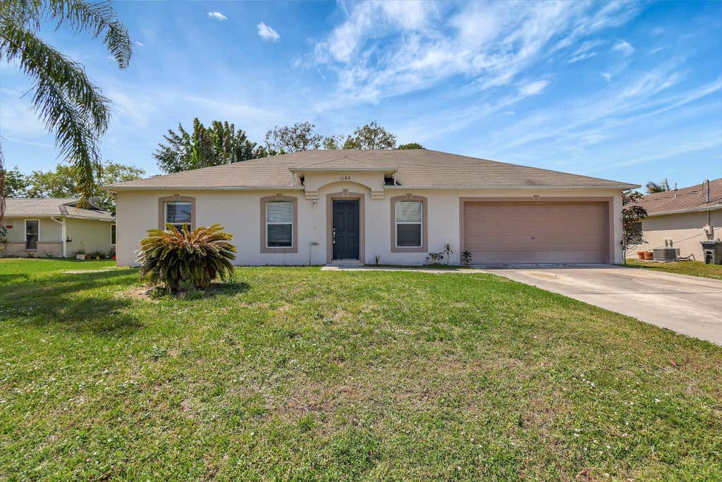 Photo of 1144 SW Ithaca Street, Port Saint Lucie, FL 34983 (MLS # R10970198)