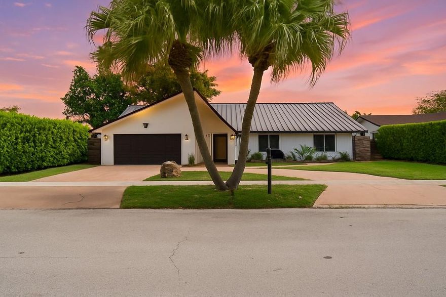 Rarely available Calusa pool home featuring 3 bedrooms plus versatile bonus room—perfect as a 4th bed or office. No expense spared in this beautifully upgraded residence, highlighted by a stunning kitchen remodel with an oversized white quartz island featuring elegant white, blue, and gold tones. Enjoy peace of mind with a 50-year metal roof, impact windows/doors, and a full-home generator with propane—capable of powering the home for two weeks. Vaulted ceilings, 2020-installed AC, tankless water heater, washer/dryer, and premium finishes throughout. The pool area is a private oasis with resurfaced pool, travertine pavers (2022), and new pump. Fresh 2024 exterior paint, modern lighting, and completely redone landscaping round out this rare gem in one of the most sought-after neighborhoods