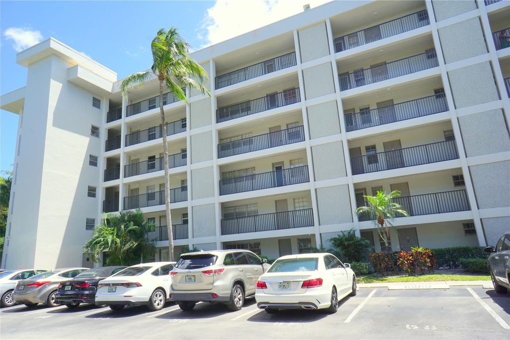 Photo of 2600 S Course Dr #410, Pompano Beach, FL 33069 (MLS # F10532101)