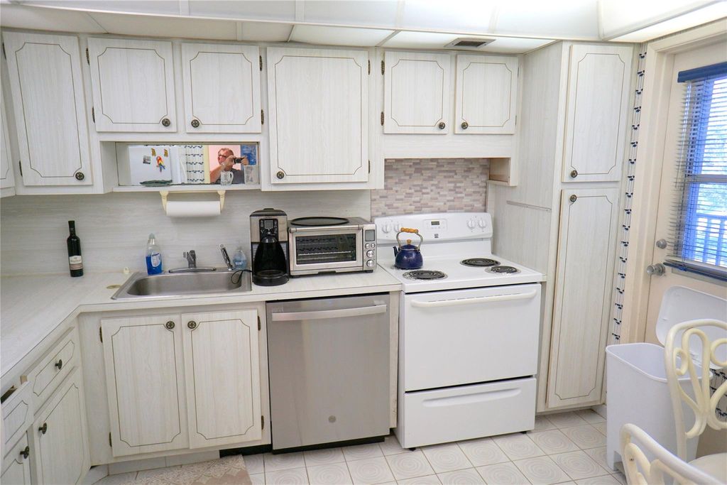 Photo of 2600 S Course Dr #410, Pompano Beach, FL 33069 (MLS # F10532101)