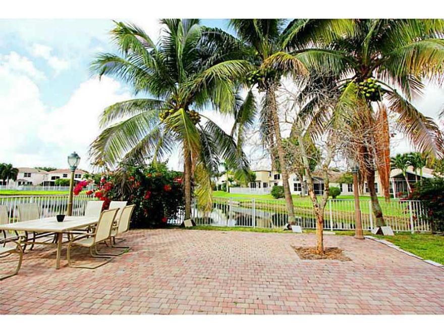 BEAUTIFUL HOUSE IN MINT CONDITION, GORGEOUS LAKE VIEW, PAVED AND FENCED PATIO, NEWER STAINLESS STEEL APPLIANCES, TILE IN THE FIRST FLOOR, CARPET IN ALL BEDROOMS,  COMMUNITY SWIMMING POOL,  EXCELLENT & QUITE COMMUNITY (GATED), CLOSE TO SHOPPING CENTER, CLO SE TO TURNPIKE AND 869 (SAWGRASS EXPRESS WAY), A+ SCHOOLS BEST OF FLORIDA, MUST SEE IT.....